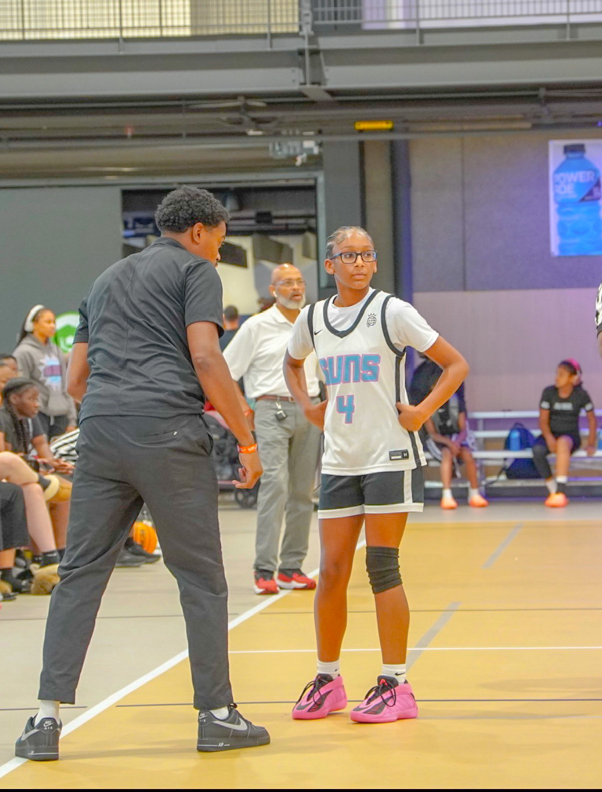 850 Suns player receiving instruction during a game